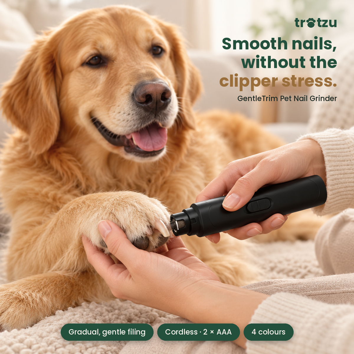 Golden retriever having its nails gently filed with the black Trotzu GentleTrim nail grinder